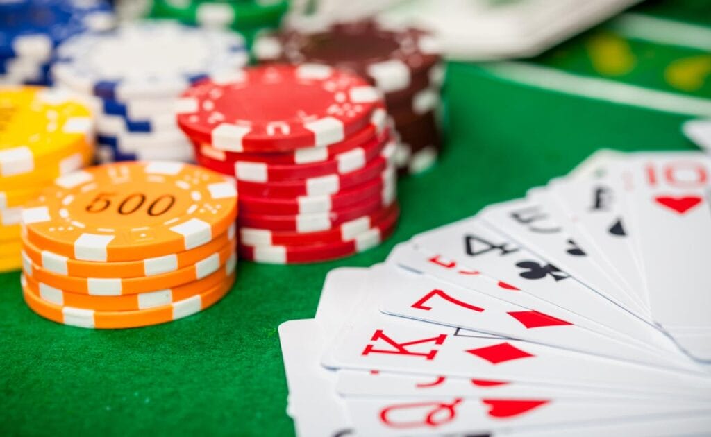 Poker cards and casino chips on a poker table.
