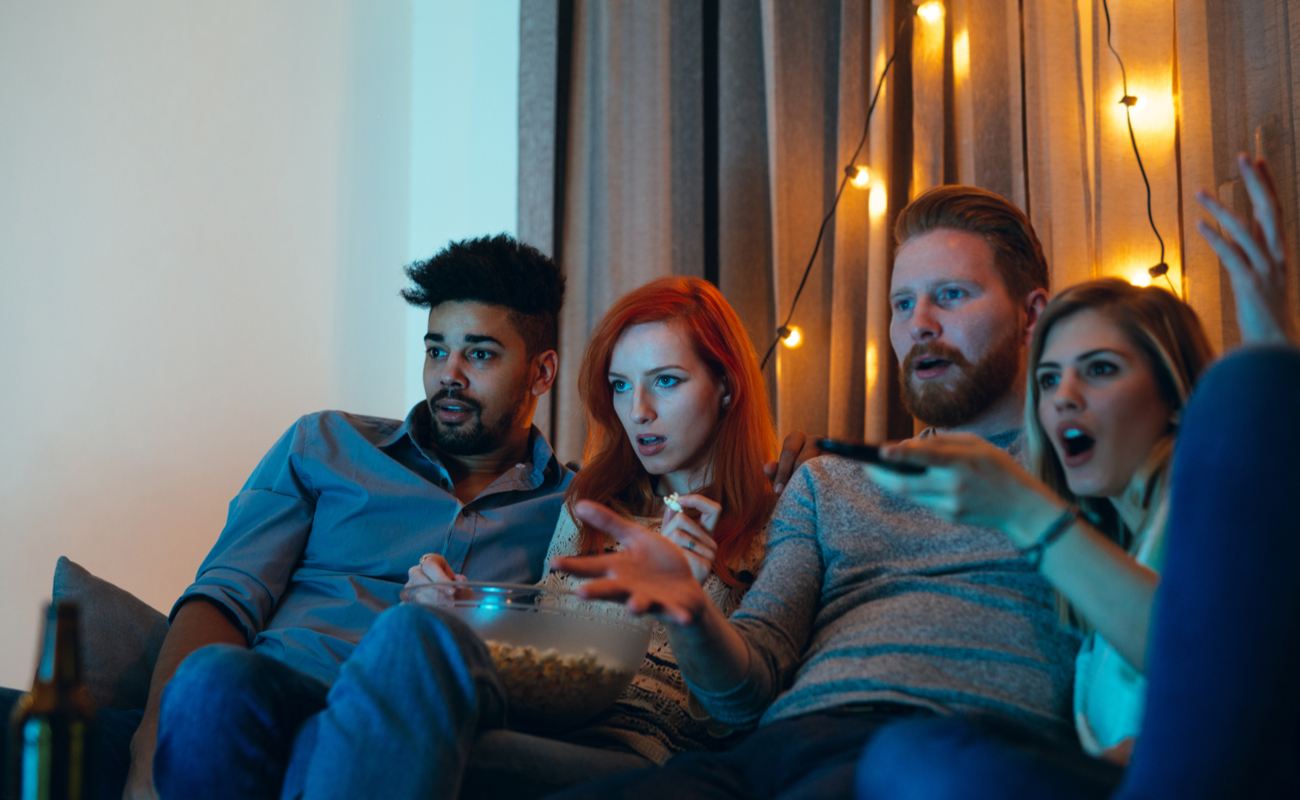 Two couples watching movies.