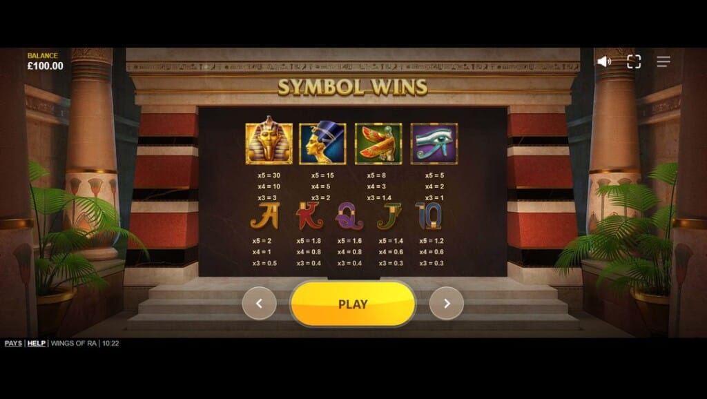 A screenshot of the symbol paytable screen from the Wings of Ra slot game. It’s set against the backdrop of an ornately detailed Egyptian temple with towering columns, potted palms, and intricate wall designs. The center panel showcases payout values for various symbols, including high-paying icons like the golden pharaoh, Nefertiti, a winged scarab, and the Eye of Horus, along with mid- and low-tier card symbols (A, K, Q, J, and 10). The values are organized in rows of five, four, or three matching symbols. A golden “PLAY” button with navigation arrows sits at the base of the screen on a wide stone staircase, inviting users to continue through the game interface. 