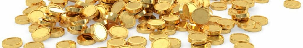 A heap of gold coins on a white surface.