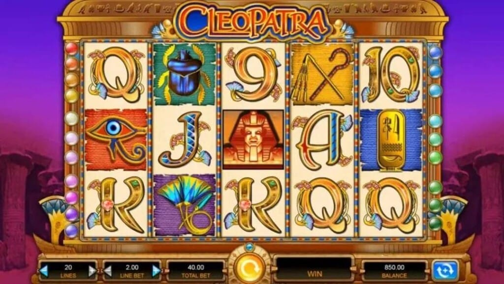 A screenshot of the Cleopatra slot reels. The game is set against ancient Egyptian ruins.