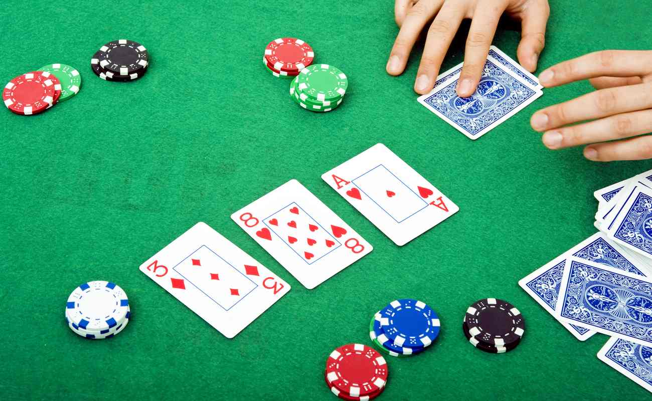 A three of diamonds, eight of hearts and an ace of hearts revealed on the flop.