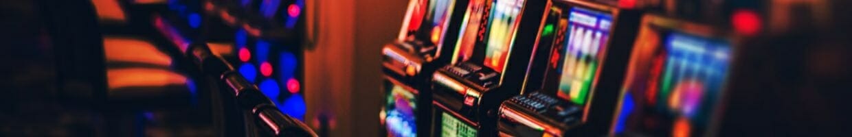 slot machines lined up next to each other in a casino