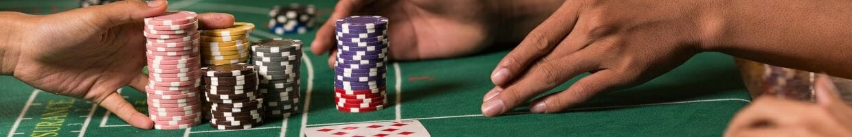  a person collecting chips after winning baccarat