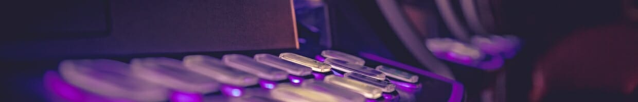 A purple slot machine with buttons.