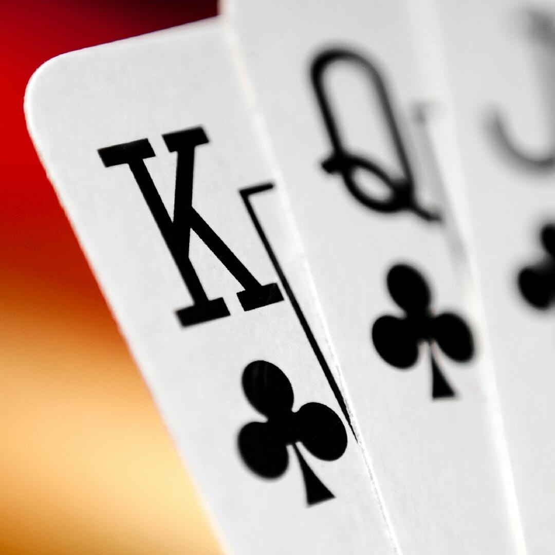 Close up of a king, queen and jack of clubs