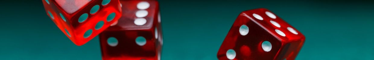  three red six-sided casino dice falling in the air 