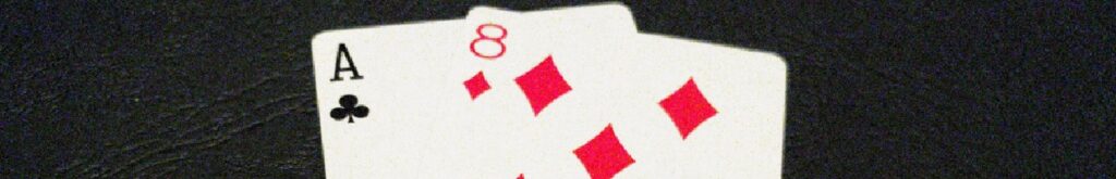 An ace and eight card on black background