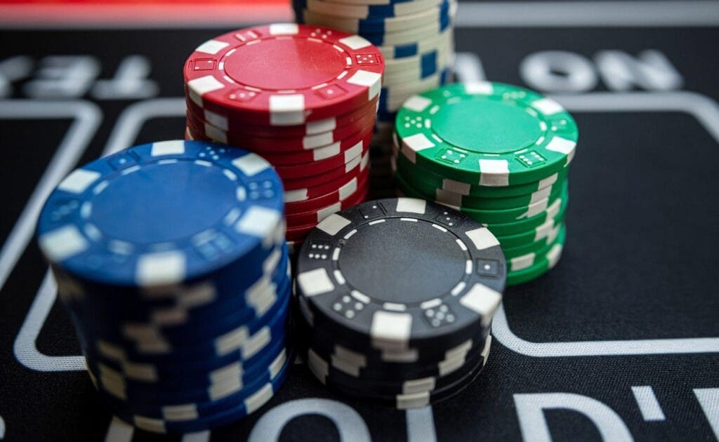 A close-up of poker chips on a casino table.