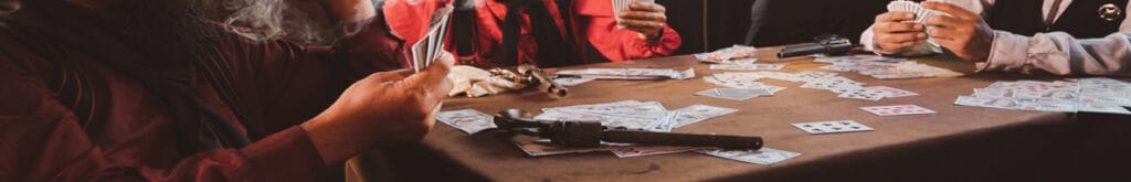 Cowboys sit around a table playing poker and smoking cigars