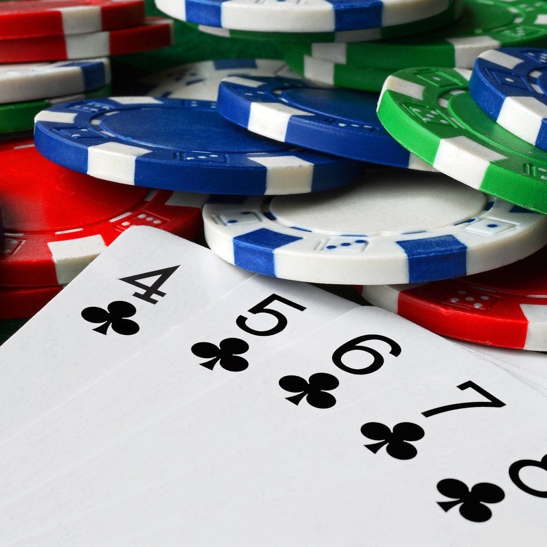 Header-A-close-up-of-playing-cards-next-to-scattered-poker-chips-Micro-stakes.jpg