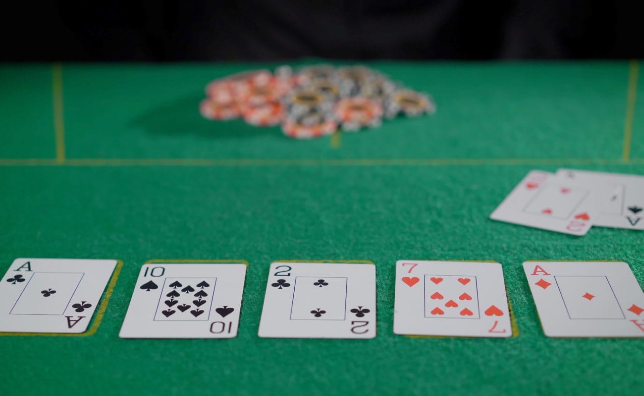 Playing cards and chips on a poker table.