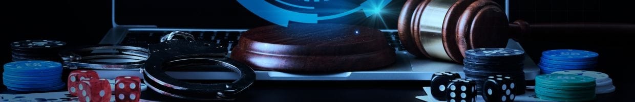 A dark image showing handcuffs, poker chips, six-sided dice, and a judge’s gavel.