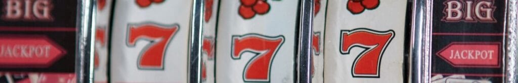 Close up image of slot symbols on a vintage slot machine.