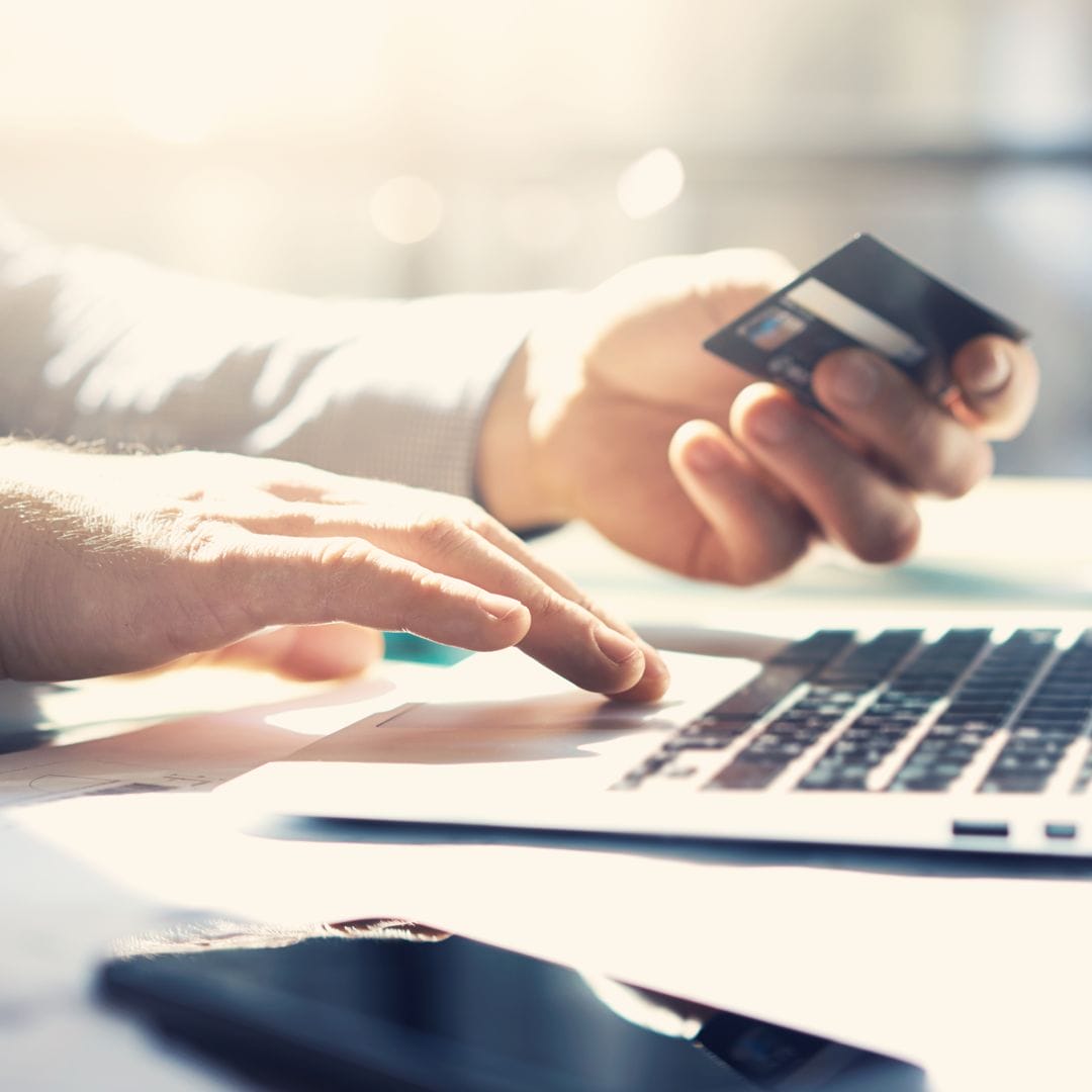 A person holding a credit card.