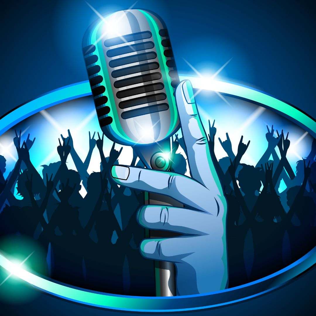 A hand holding a retro microphone in front of huge silhouetted crowd waving their arms at a concert; A blue and teal color theme is used with bright lights for effect.