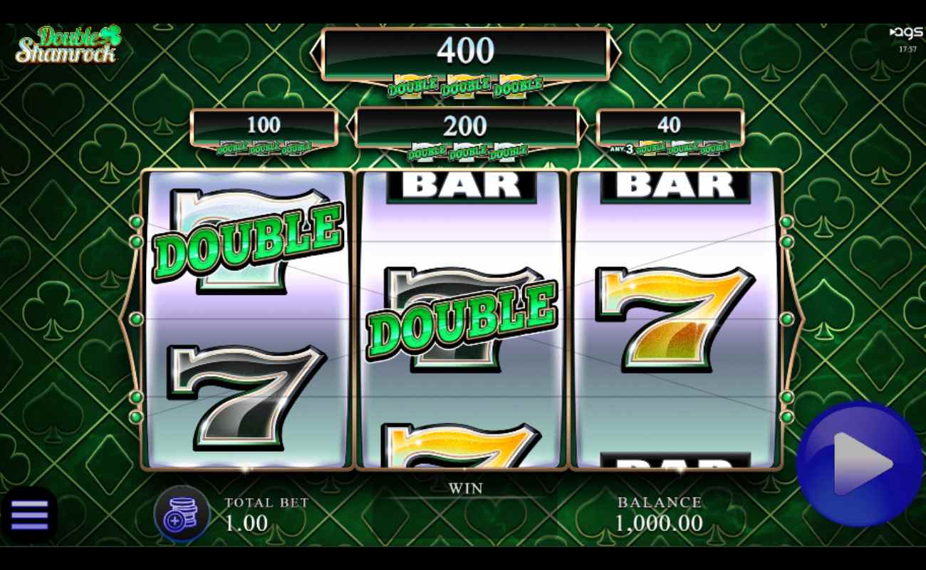 Double Shamrock online slot with the classic three-reel slot machine. There are number seven and bar symbols on the reels. The background has playing card suits such as the club, diamond, spade, and heart against a green background.