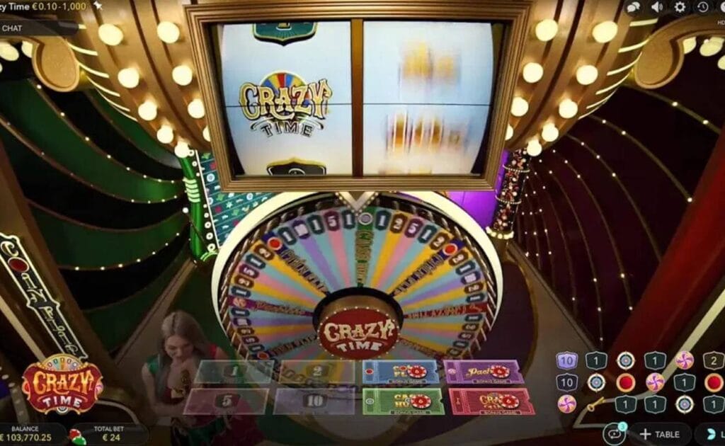 A high-angle view of the Crazy Time wheel and the game host. All of the interface options are visible as well.