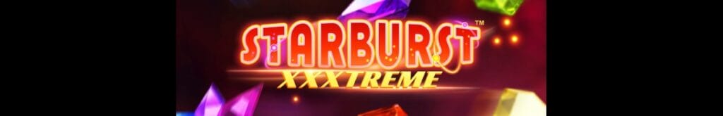 Starburst XXXtreme online slot game logo in red and gold. There are green, yellow, and purple gemstones in the background.