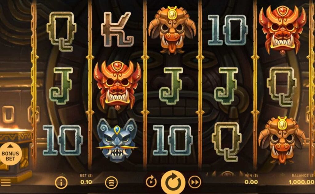 A screenshot of the gameplay of Rise of Maya, featuring mask and playing card symbols on a 5x3 slot grid with the button to activate the Bonus Bet feature displayed to the left of the reels.