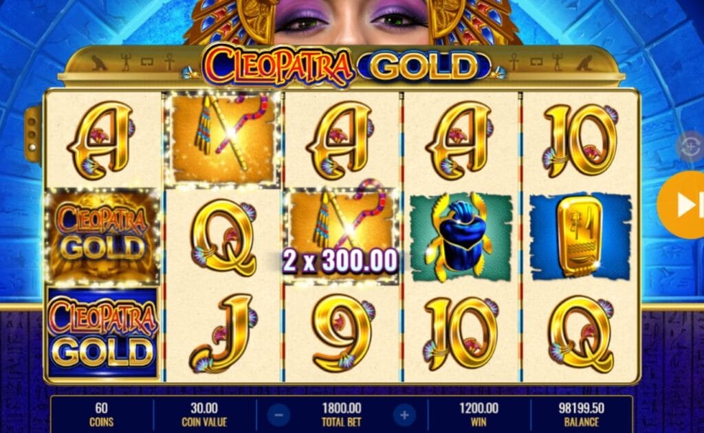A screenshot of a $1,200 win on the Cleopatra Gold slot game, a mix of low and high-paying symbols as well as a few themed bonus symbols appear on a 5x3 slot grid with Cleopatra peering over the top of the reels.