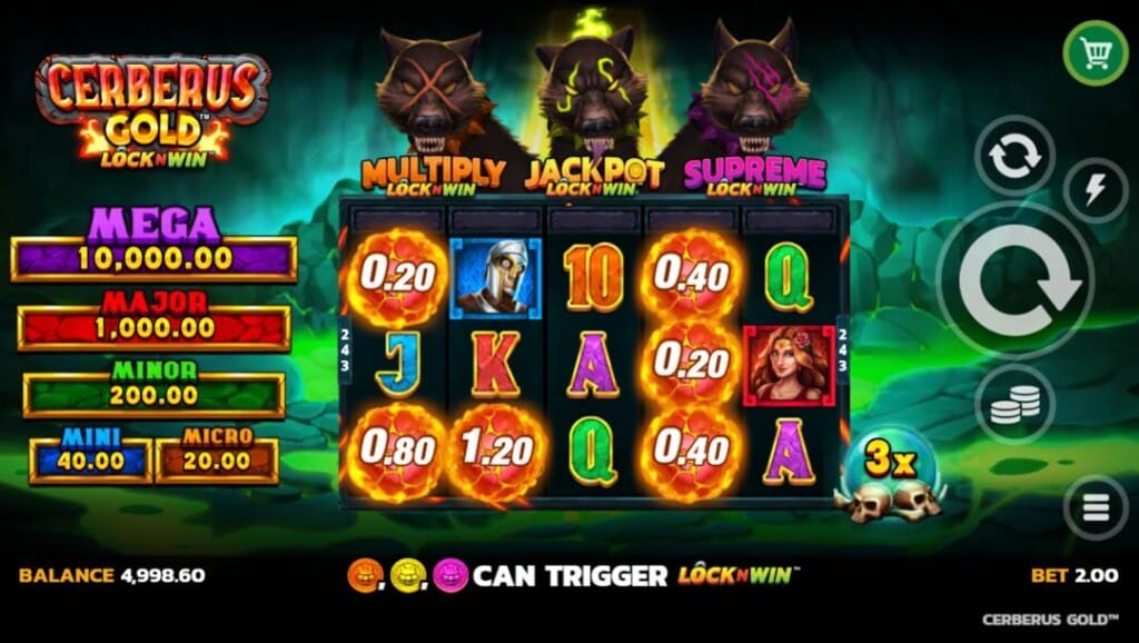 A screenshot of the slot reels in Cerberus Gold LockNWin. The background is a rocky pit with streams of green lava running along the floor. In the foreground are the slot reels containing a variety of themed and regular symbols. The themed symbols include fireballs, a mad soldier, and a beautiful redhead woman with different colored markings. Regular symbols include the A, K, Q, J, and 10. Above the reels are the three heads of Cerberus, each associated with one of the LockNWin features. The first is the Multiply LockNWin feature, the second is the Jackpot LockNWin feature, and the last is the Supreme LockNWin feature. To the left of the reels are the five jackpot rewards, and to the right, the game interface.