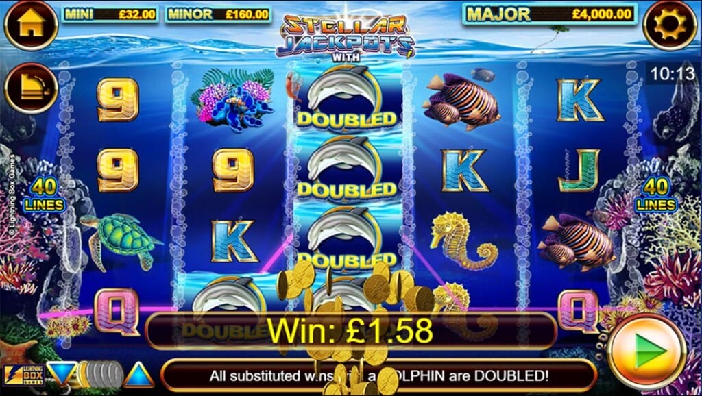 A screenshot of a big win in Dolphin Gold Stellar Jackpots. In the foreground, the game reels feature sea creatures — dolphins, seahorses, turtles, and colorful fish — with the central reel showing stacked "DOUBLED" dolphin symbols, contributing to a win. The reels are set against a deep ocean background teeming with coral reefs and marine life. Jackpot values for the Mini, Minor, and Major jackpots are shown at the top, while gold coins scatter across the bottom of the screen. The game interface is visible in the top right, top left, and bottom of the slot reels.