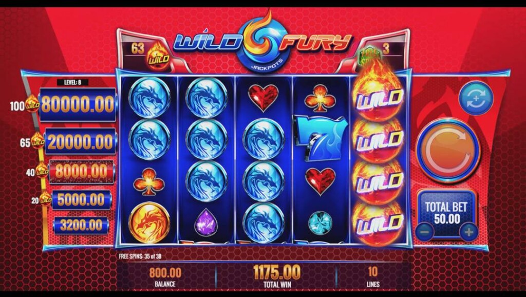 A screenshot of the Wilf Fury Jackpots free spin feature. The background is shades of orange with hexagonal shapes. In the foreground are the slot reels with various playing card symbols, blue and orange dragon orbs, as well as wild symbols. The jackpot ladder is on the left of the reels and the third prize from the bottom is highlighted.