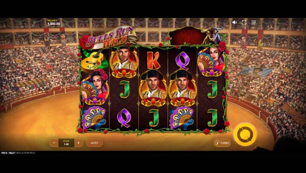 A screenshot of the slot reels in Bulls Run Wild. The setting is a dusty arena with the stands packed with audience members. In the foreground are the slot reels with Spanish- and bullfighting-themed symbols, as well as regular playing-card-themed symbols.