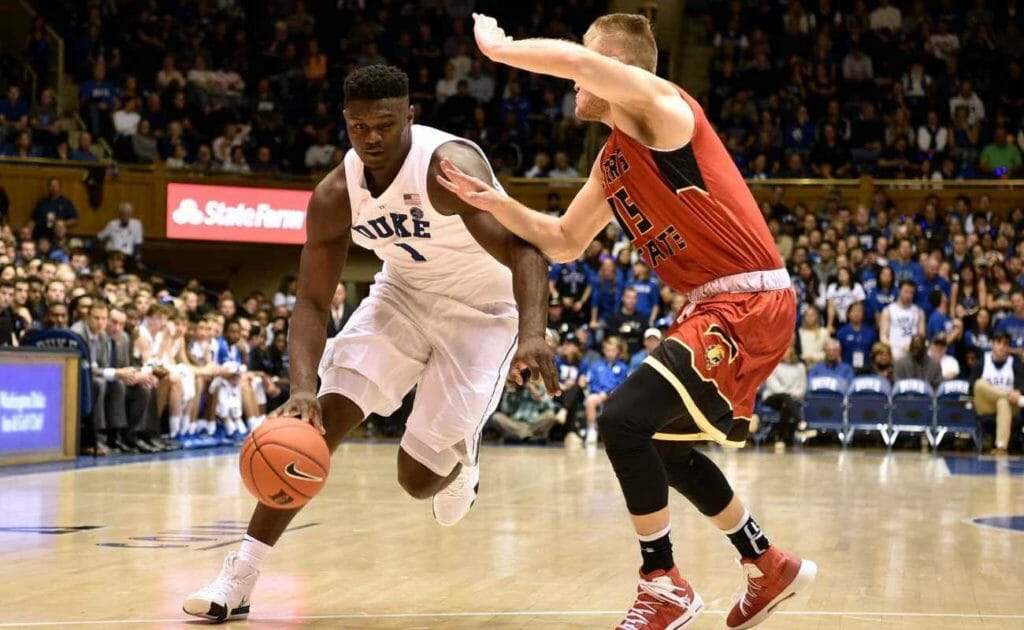 Zion Williamson #1 of the Duke Blue Devils drives against Greg Williams #15 of the Ferris State Bulldogs