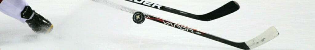 Sticks fight for the puck