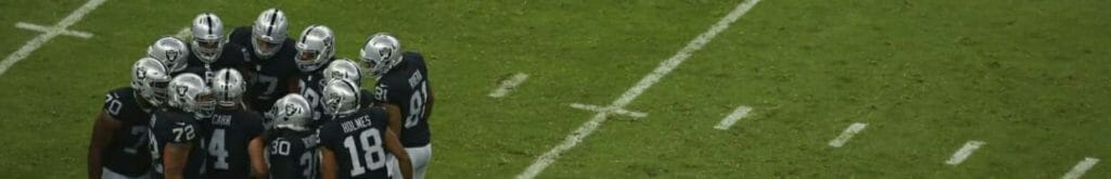 NFL football team huddle