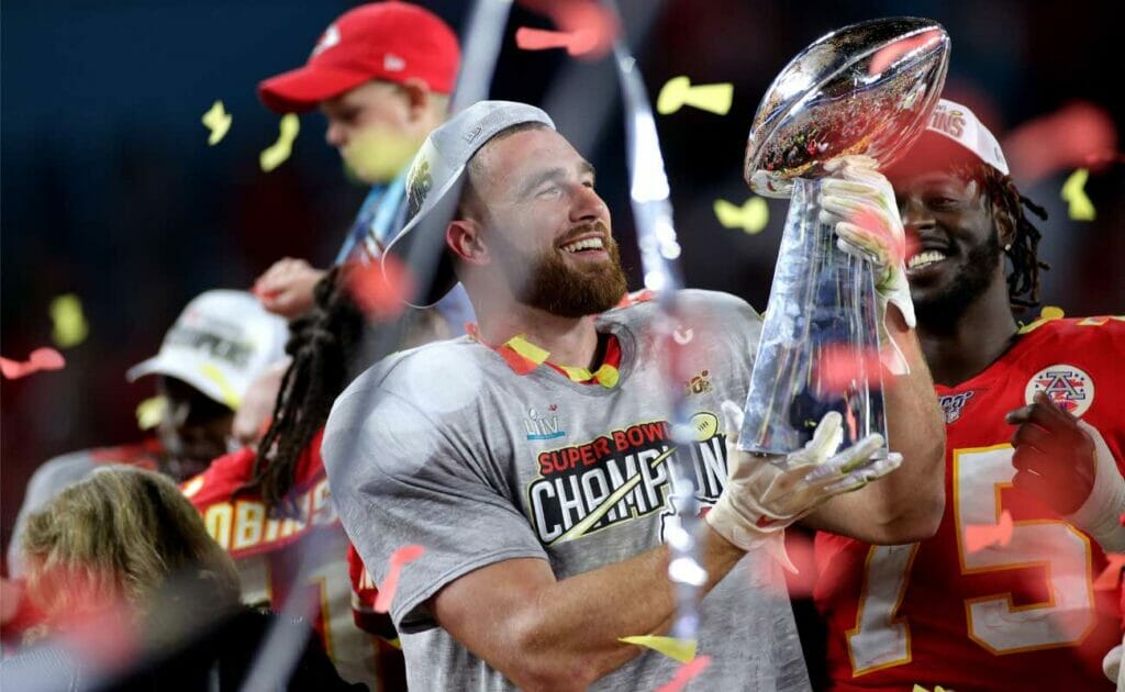 Travis Kelce of Kansas City Chiefs celebrates with the Vince Lombardi Trophy at Hard Rock Stadium February 2020