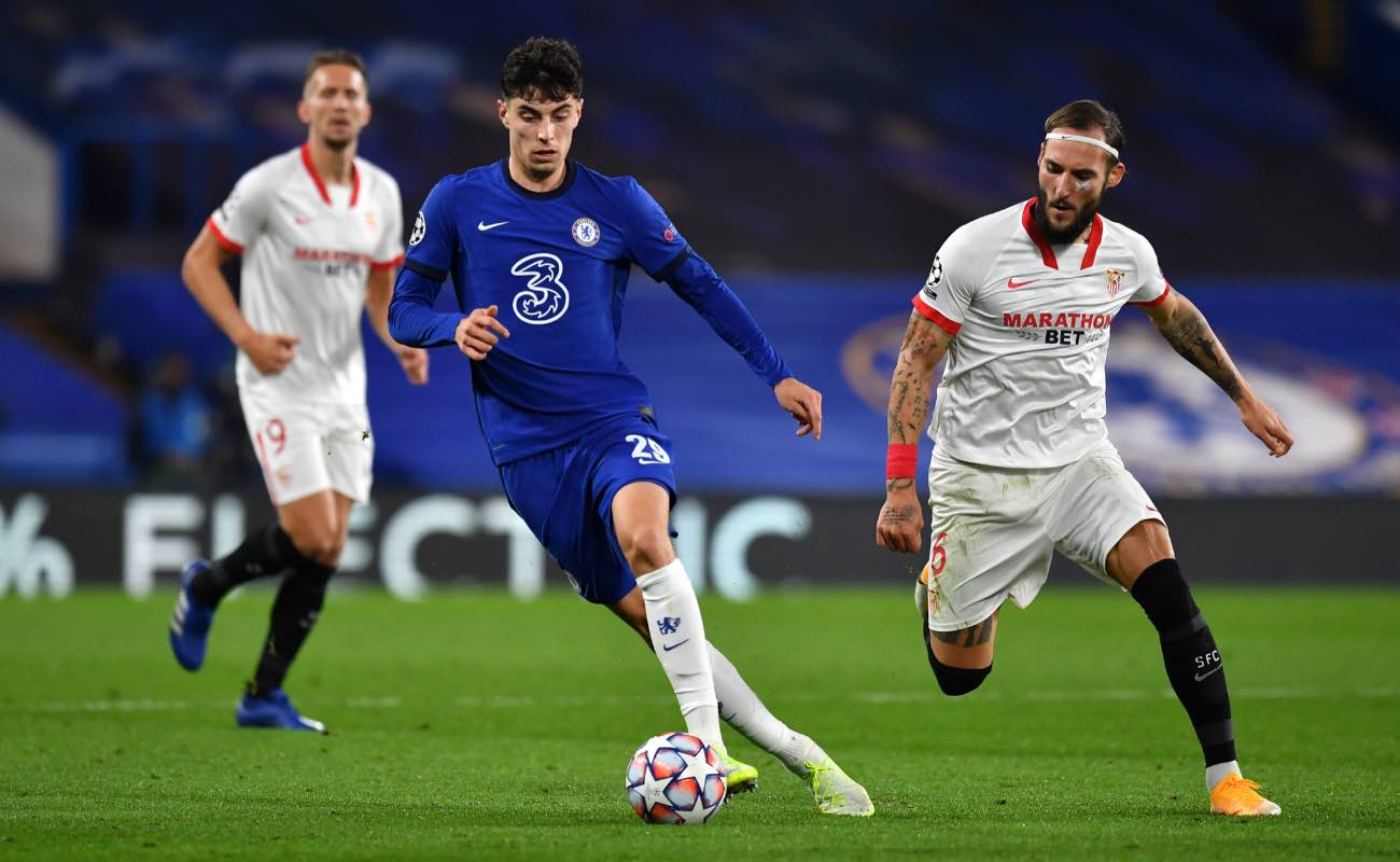 Kai Havertz of Chelsea against Nemanja Gudelj of FC Sevilla during the UEFA Champions at Stamford Bridge October 2020. Photo by Glyn Kirk - Pool/Getty Images.