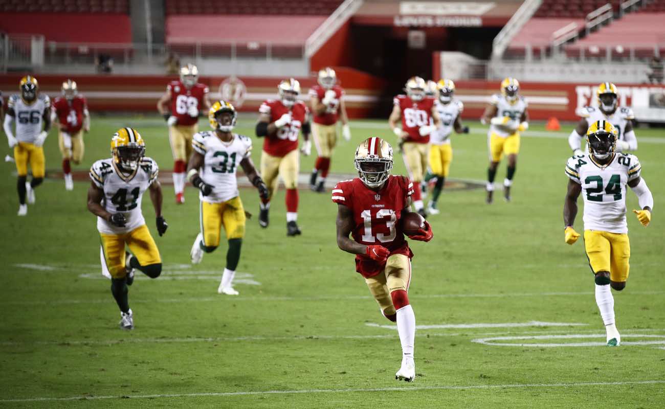 Richie James #13 of the San Francisco 49ers runs for a touchdown against the Green Bay Packers at Levi's Stadium November 2020. Photo by Ezra Shaw/Getty Images.