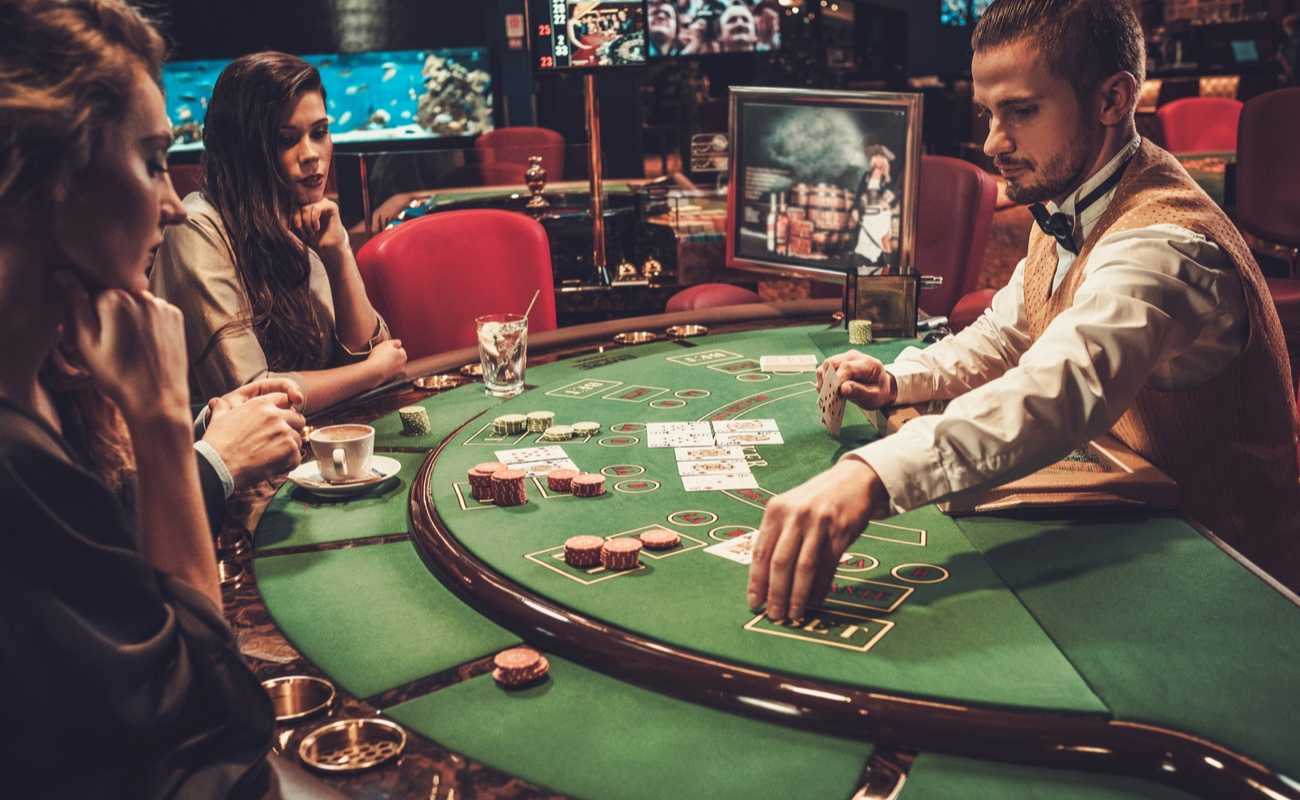 beautiful young women playing poker in a casino