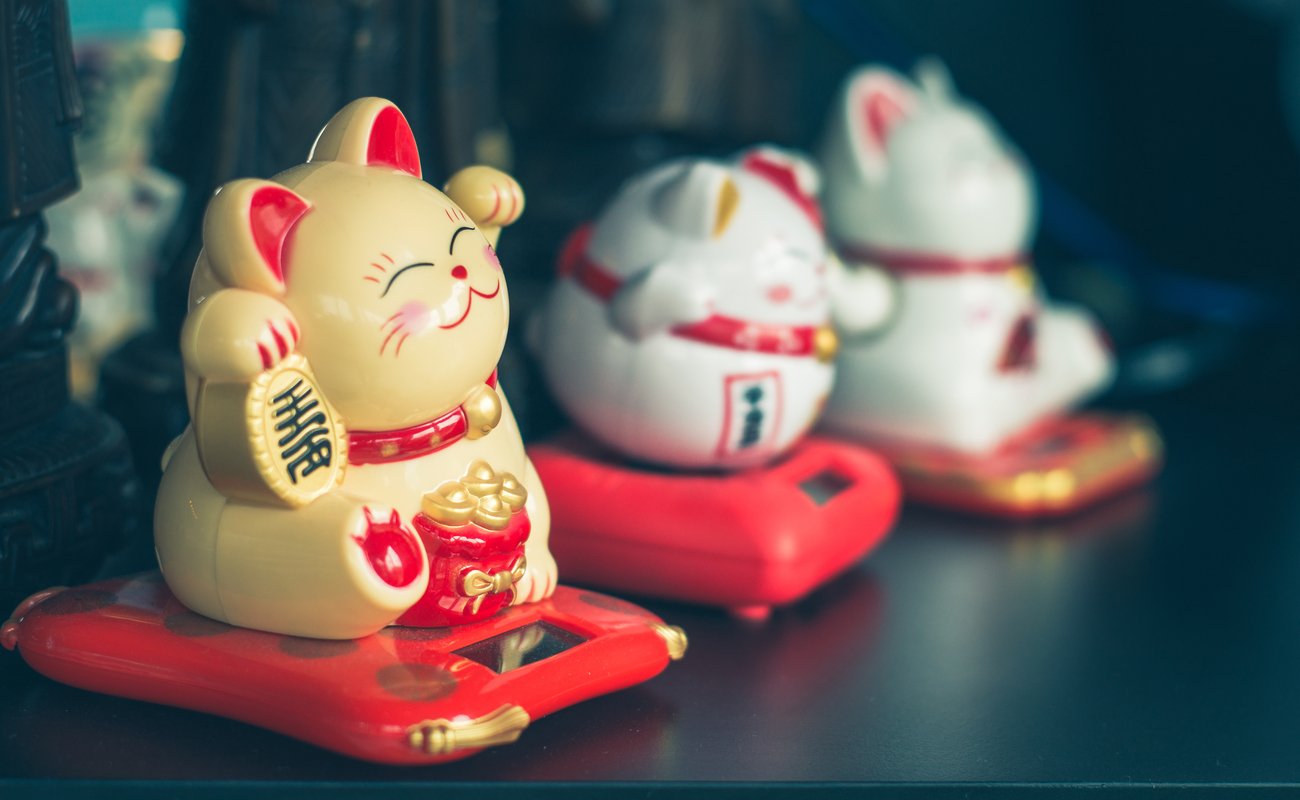 Three Maneki Neko Japanese lucky cat figures