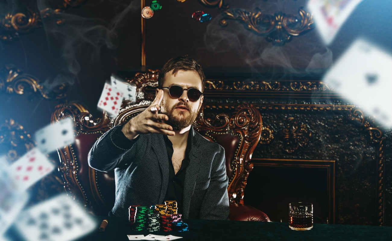 A wealthy mature man playing poker in a casino
