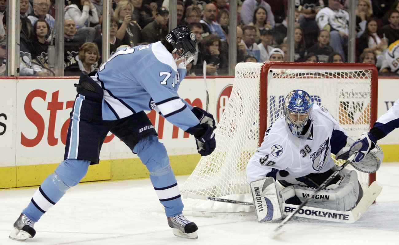 Tampa Bay Lightning vs Pittsburgh Penguin with goalie blocking the puck.