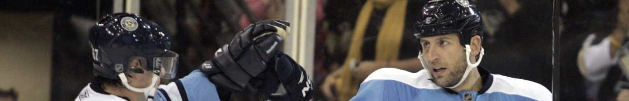 Pittsburgh Penguins players high five each other