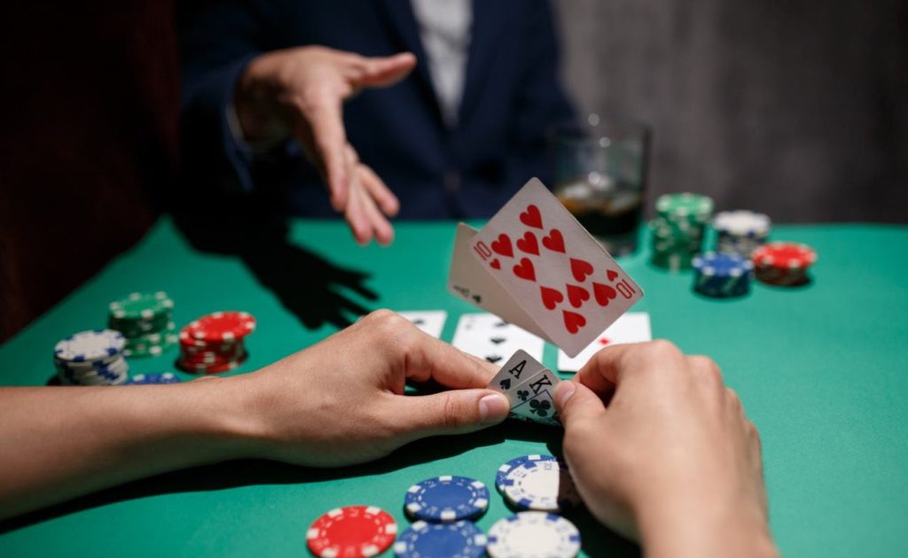 Professional poker player folds by throwing cards on the table