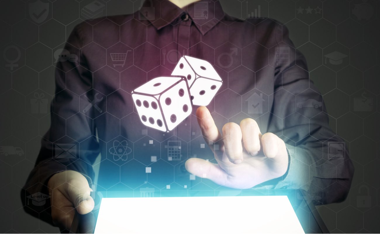 Casino waitress holding a tablet showing a virtual and dice icon