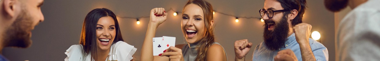 A woman celebrates her win at a casino party.