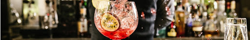 Mixologist making a cocktail.