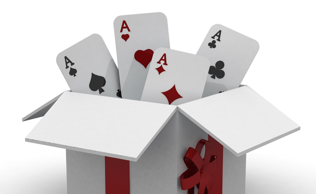 3D concept of a gift box with ace playing cards coming out of it.