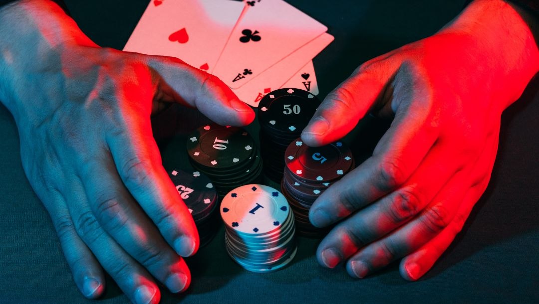 Header-Man-claiming-poker-chips-after-winning-hand-ROAR-BetMGM.jpg