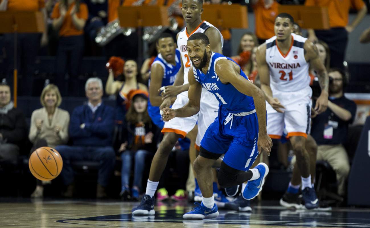 Guard Trey Houston #11 of the Hampton University Pirates goest after a loose ball against University of Virginia at John Paul Jones Arena