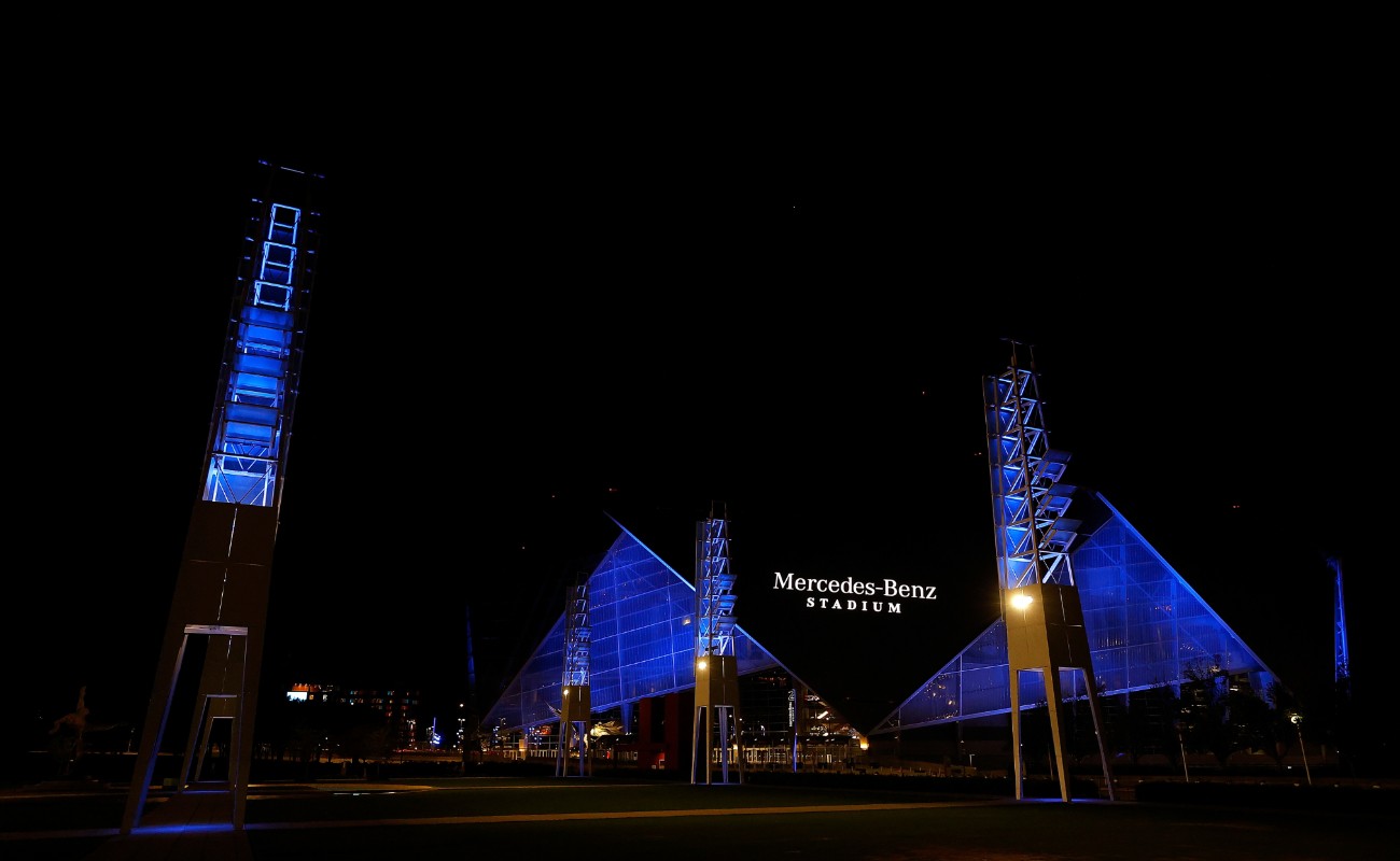 Mercedes Benz Stadium at night blue lights