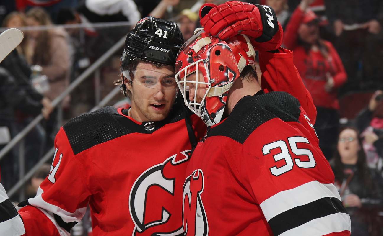 Michael McLeod and Cory Schneider of New Jersey Devils celebrate their victory over St. Louis Blues