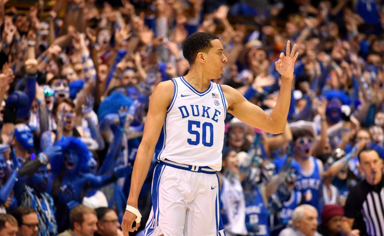 Justin Robinson of Duke Blue Devils reacts after making a three-point basket during basketball game